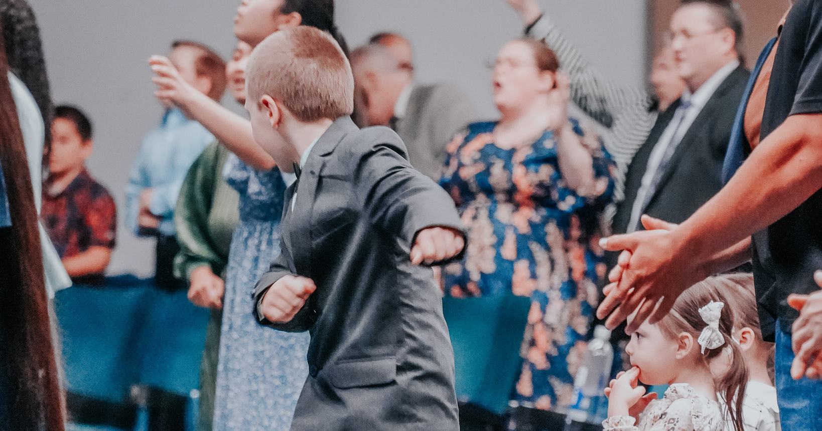 Families and children rejoicing together during praise and worship at Praise Tabernacle Las Vegas